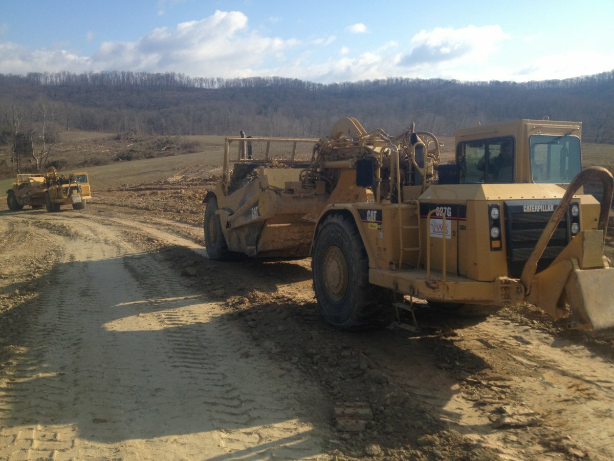 bulldozers going over dirt